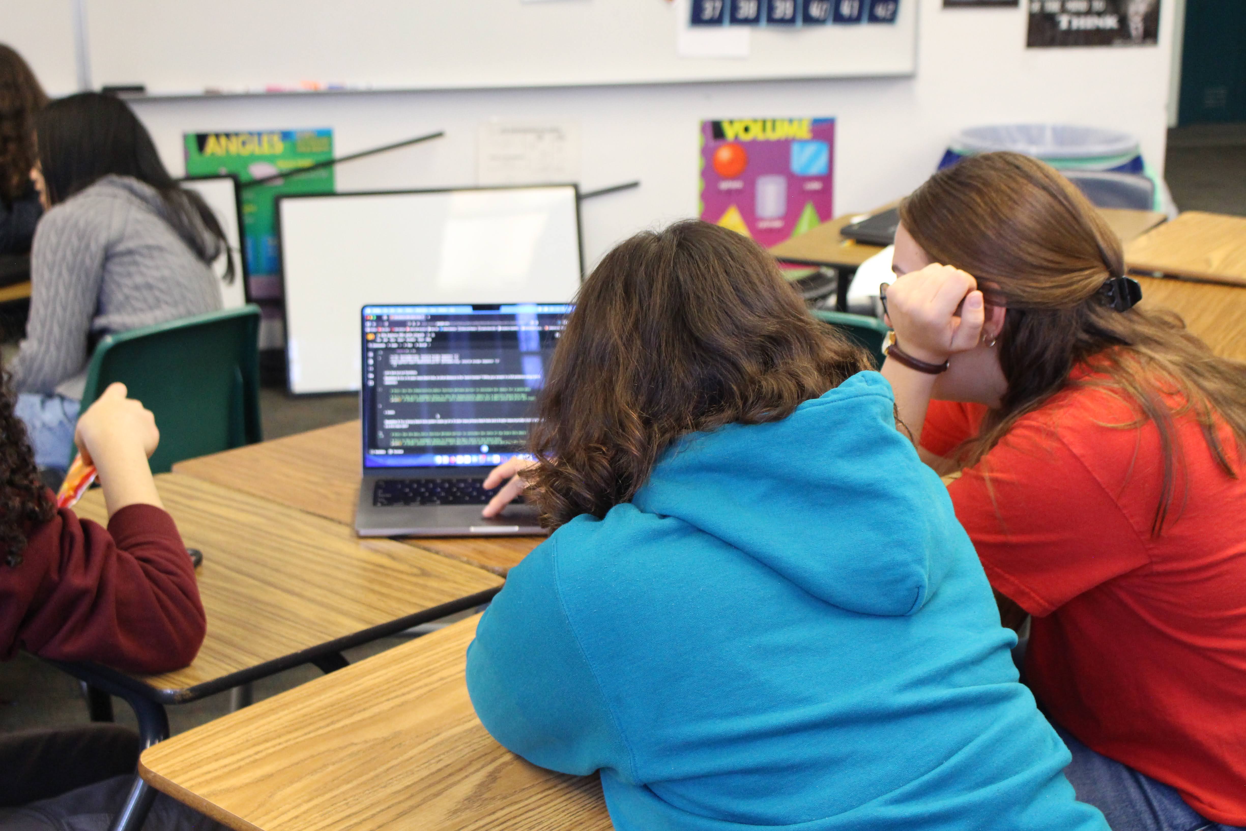 Madeline Overton explaining the GW Explorer NB1 to a student